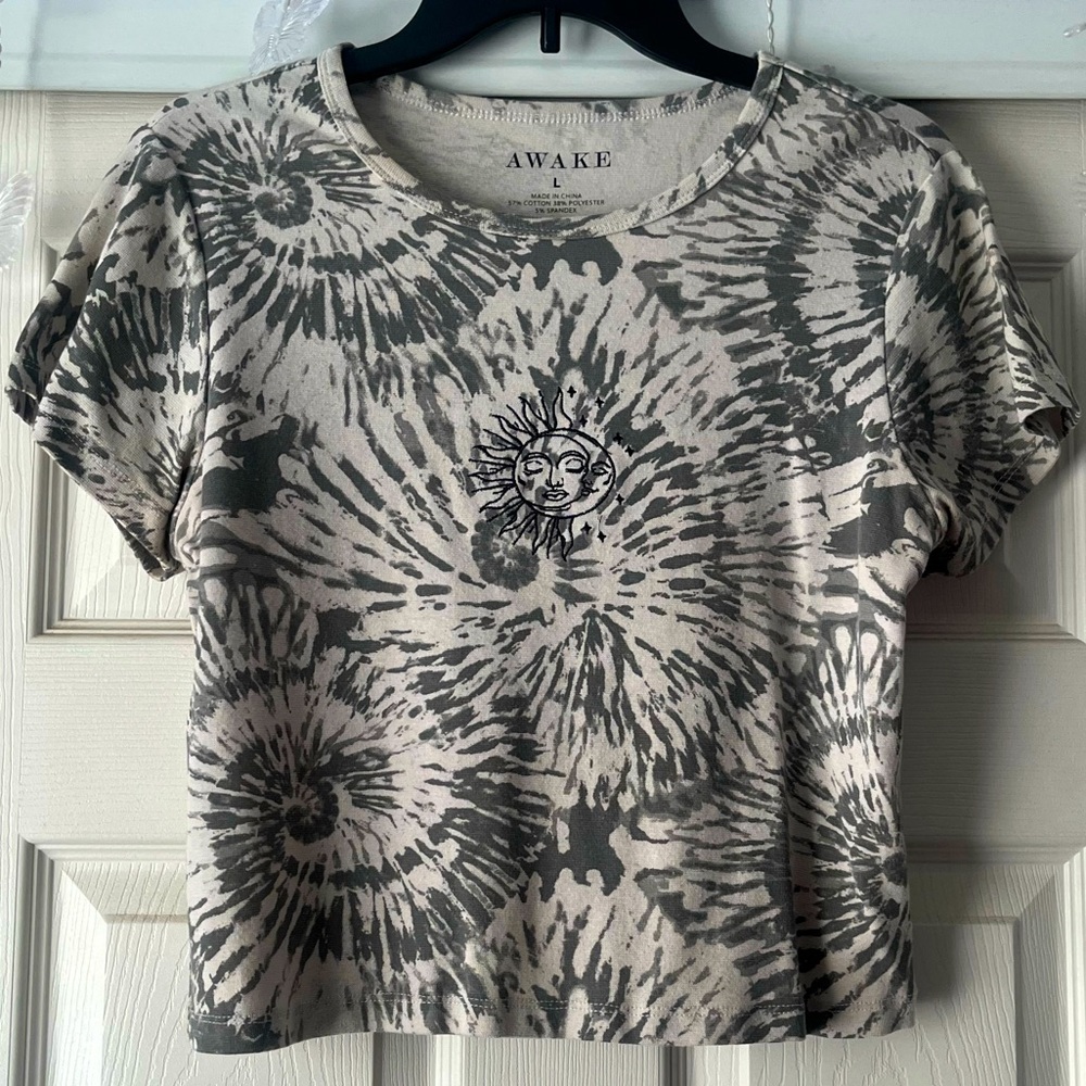 Tie dye shirt that fits slightly cropped.